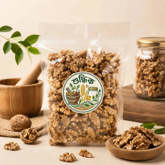 Fresh premium Shudhik walnut nuts in their shells, showcasing the natural brown color and textured surface of the premium akhrot.