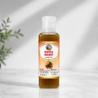 Shudhik castor oil bottle, 100ml, natural oil and ghee for skincare and hair care, with a clear label showing the product.
