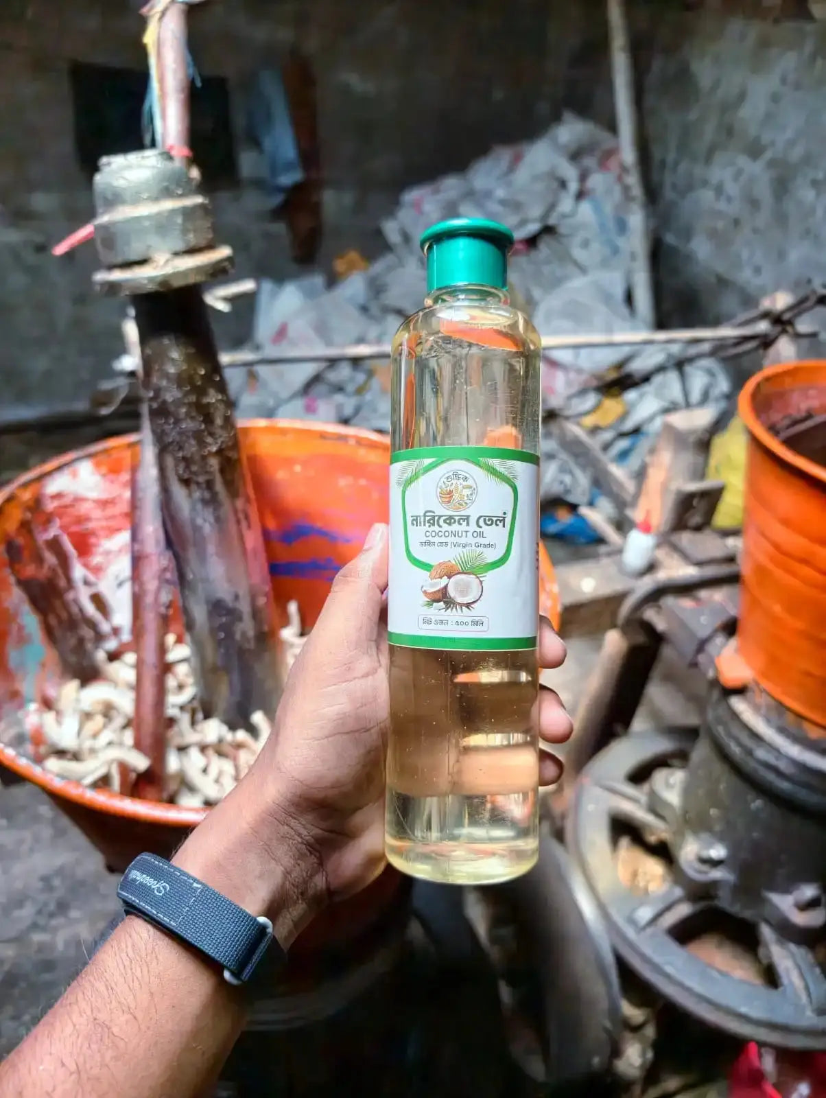 Shudhik extra-virgin coconut oil for hair care, showing a bottle of nourishing coconut oil on a plain background