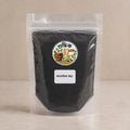 Shudhik Kalojira Powder, organic black cumin herb powder in a jar, used for cooking and health benefits in Bangladesh.