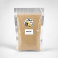 Shudhik Shikakai powder, natural herbal hair care product, shown in a clear container, ideal for traditional hair cleansing.