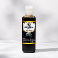 Shudhik Black Seed Oil in a 100ml bottle, natural oil & ghee product with dark amber liquid, ideal for health and wellness.