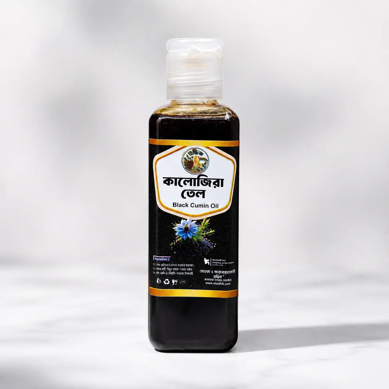 Shudhik Black Seed Oil in a 100ml bottle, natural oil and ghee product with dark color and simple label, suitable for health use.