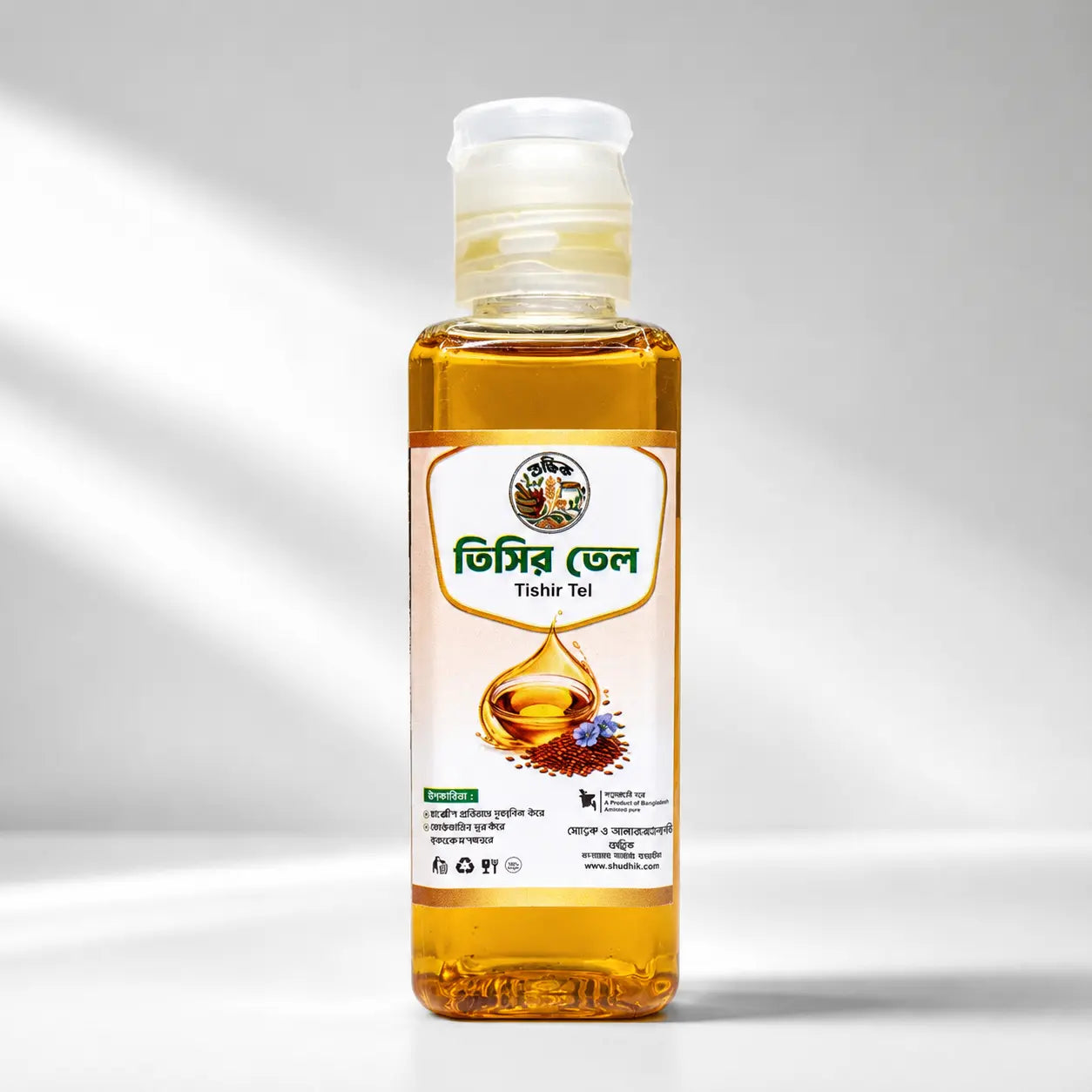 Shudhik Flaxseed Oil 100ml bottle, golden flaxseed oil in a clear glass bottle with a white cap, ideal for cooking and health.