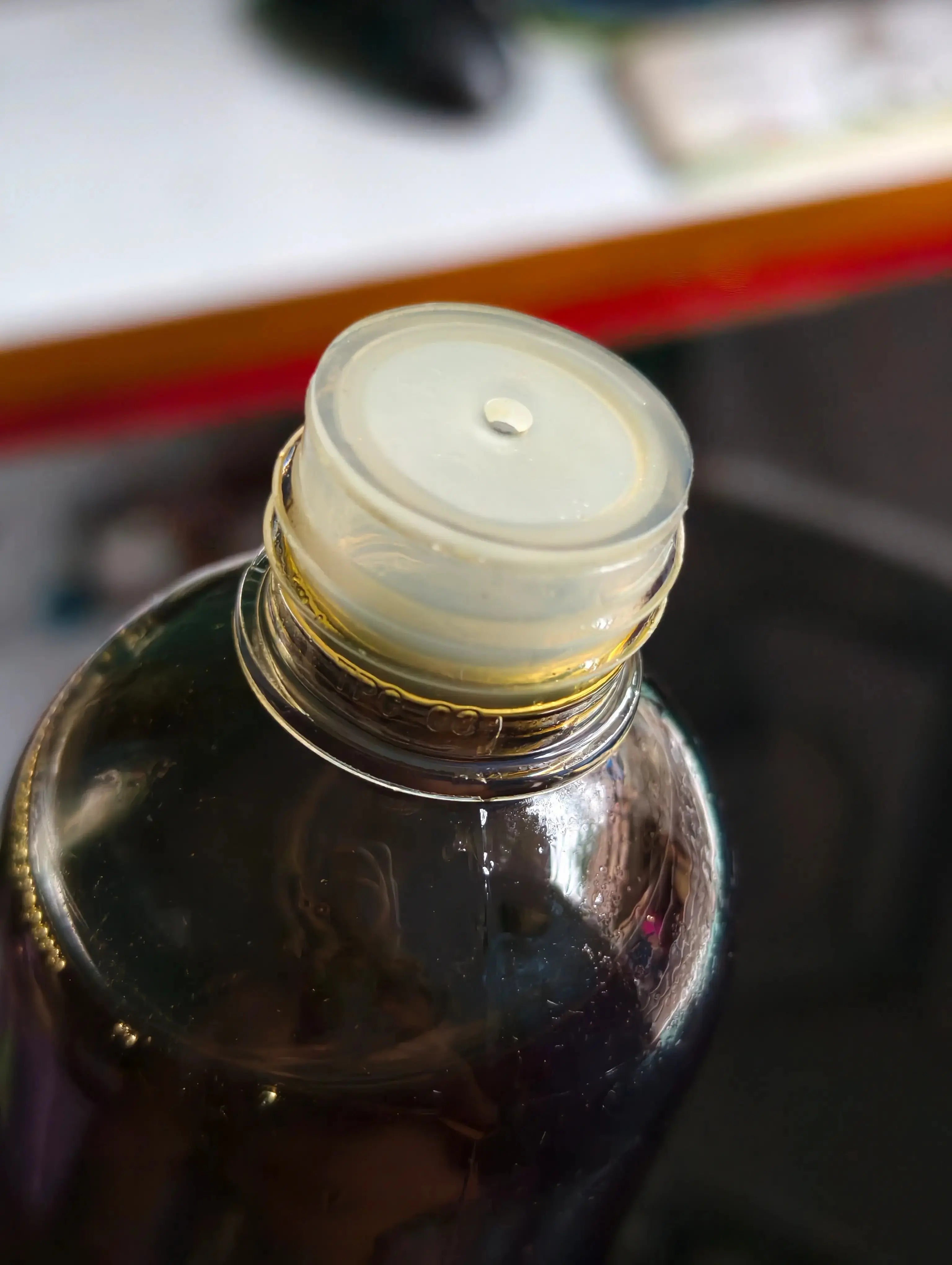 Shudhik Black Seed Oil bottle, dark glass container with label, showcasing the black seed oil product in a natural setting.