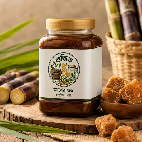 Shudhik premium Akher Gur (আখের দানা গুড়) in a jar, showcasing golden, chunky natural gur made from sugarcane juice.
