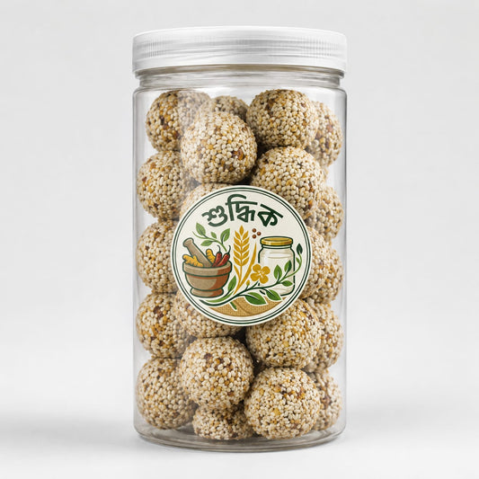 Shudhik Premium Biotin Laddu superfood in jar with sesame and nuts, natural healthy snack with rich ingredients.